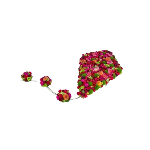 rouwbloemwerk in de vorm van een vlieger. opgemaakt met verse bloemen